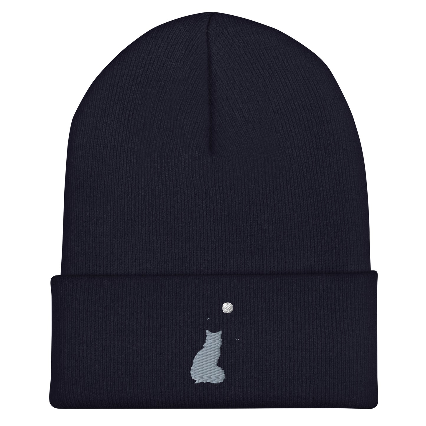 Navy blue cuffed beanie with an embroidered design. Light blue colored cat with a light yellow moon in sky.