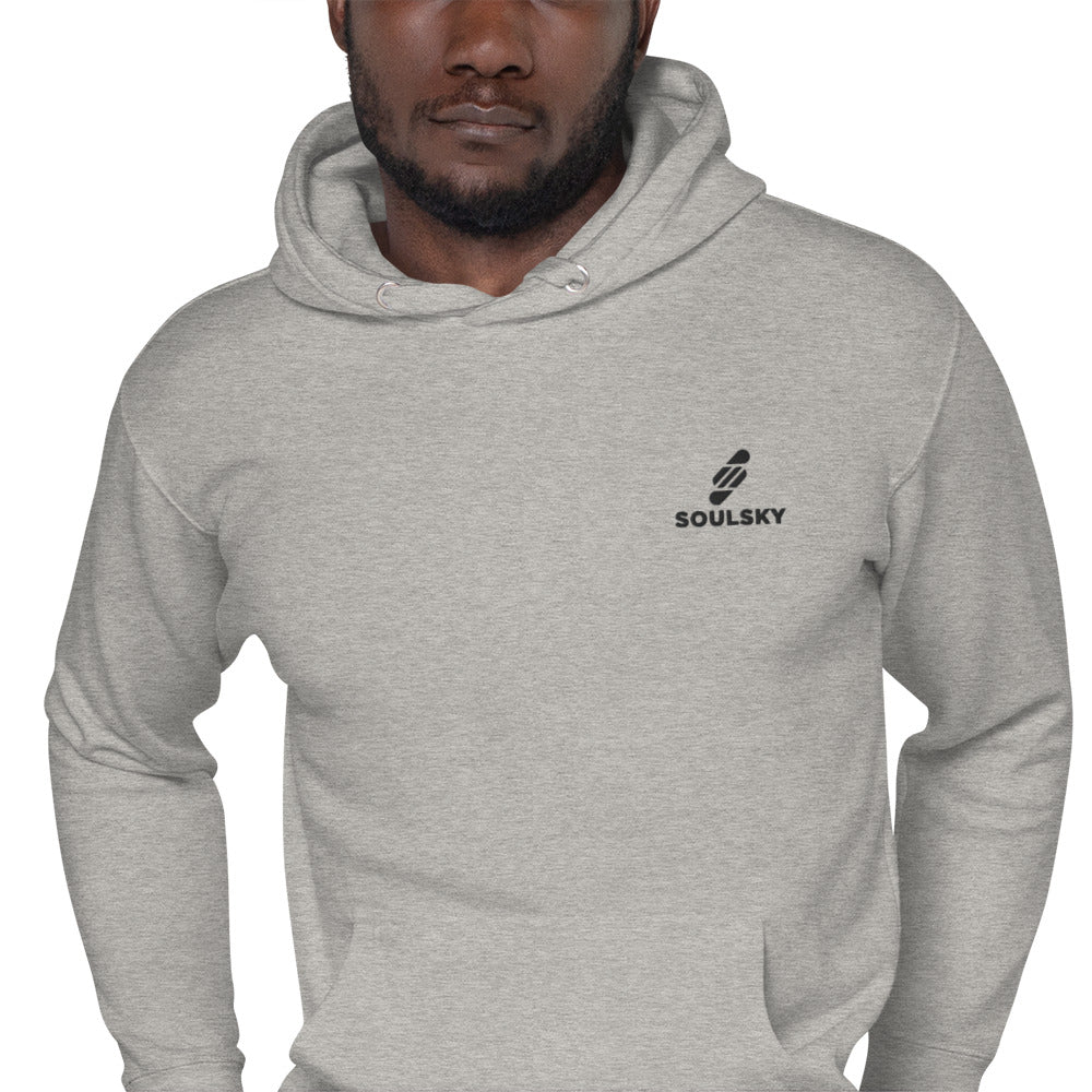 Black male model wearing a unisex premium carbon grey hoodie with a black embroidered SOULSKY logo on the left chest side.