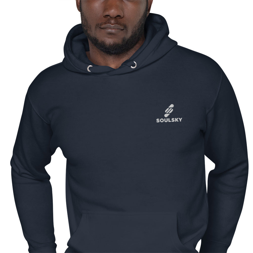 Black male model wearing a unisex premium navy blue hoodie with a white embroidered SOULSKY logo on the left chest side.