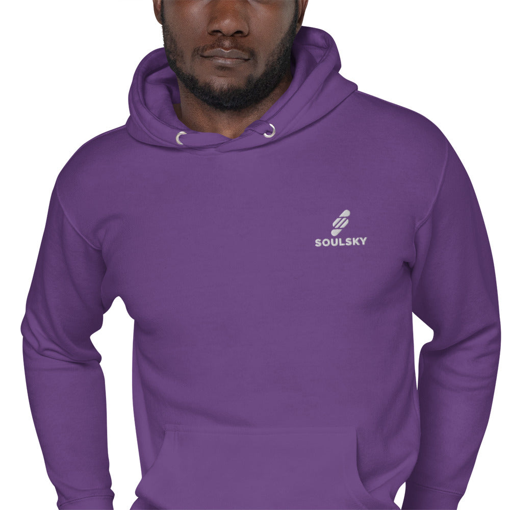 Black male model wearing a unisex premium purple hoodie with a white embroidered SOULSKY logo on the left chest side.