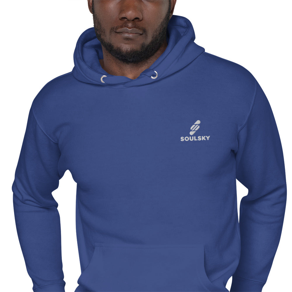 Black male model wearing a unisex premium royal blue hoodie with a white embroidered SOULSKY logo on the left chest side.