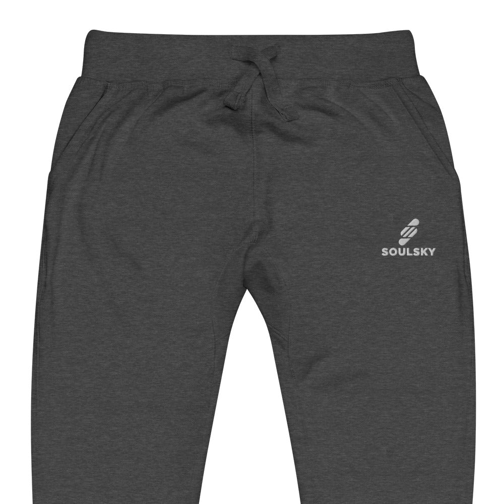Half pic of charcoal gray heather unisex joggers with white embroidered logo on left thigh that says "SOULSKY".