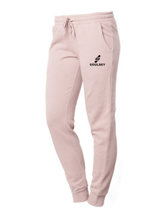 Light pink women's joggers with black embroidered logo on left thigh that says "SOULSKY".