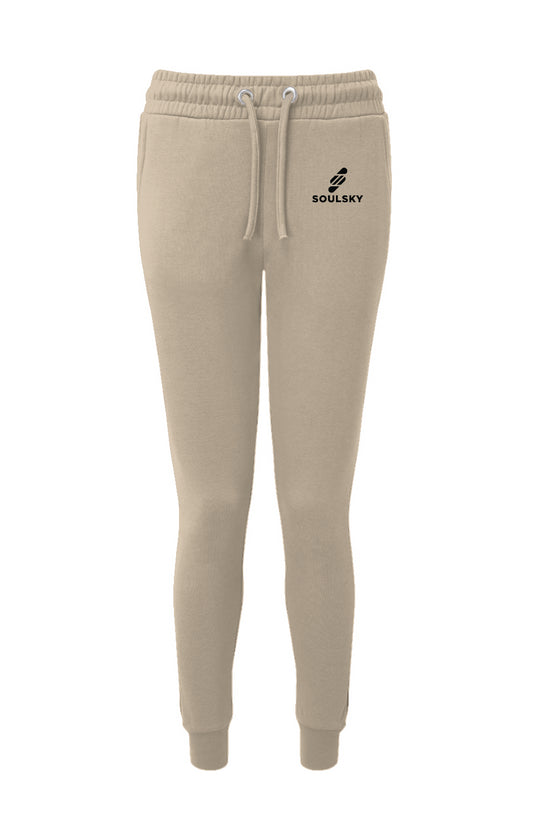 Sand colored women's joggers with black embroidered logo on left thigh that says "SOULSKY".