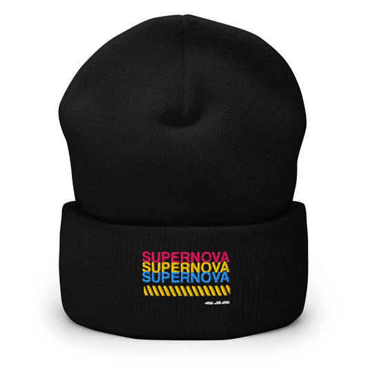 Black cuffed beanie with an embroidered design. 'Supernova is written in 3 rows in 3 colors pink, yellow, and blue. There's a yellow zig zag row below.