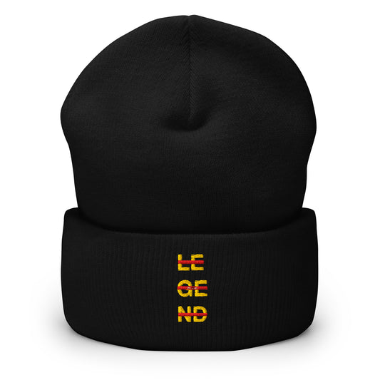 Black cuffed beanie with an embroidered design. Yellow text that says 'LEGEND' with red lines going across the letters.