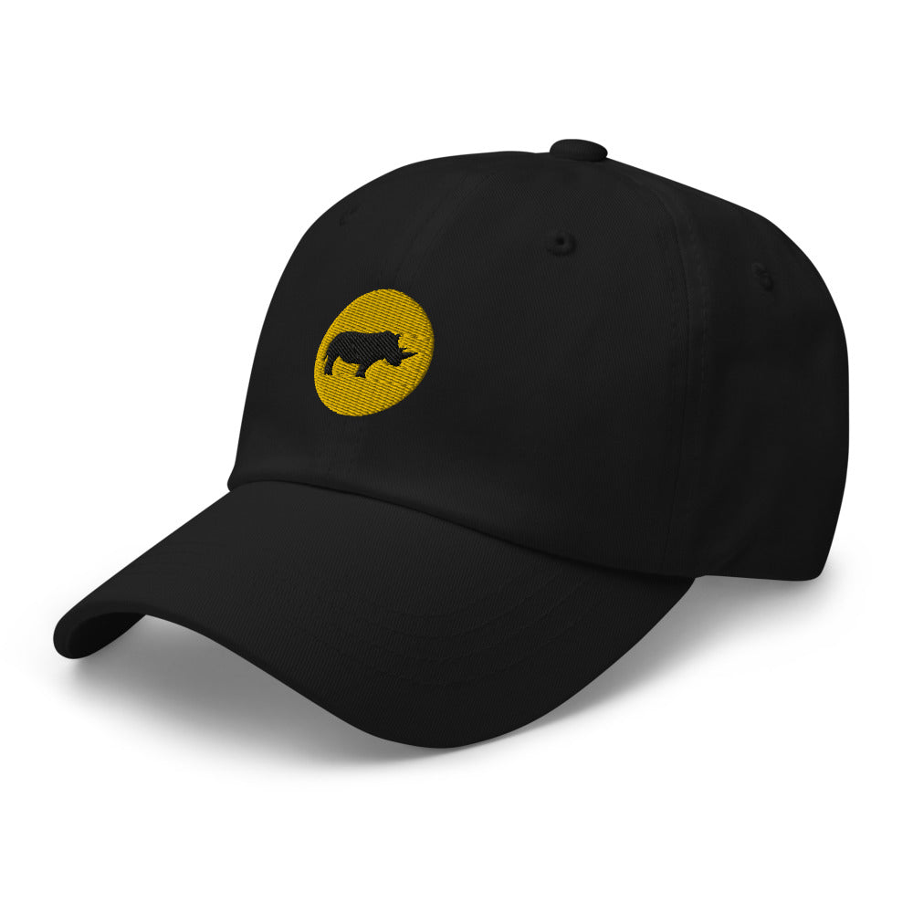 Black dad hat with an embroidered yellow circle and a black rhino in the middle. Hat is turned to it's left.