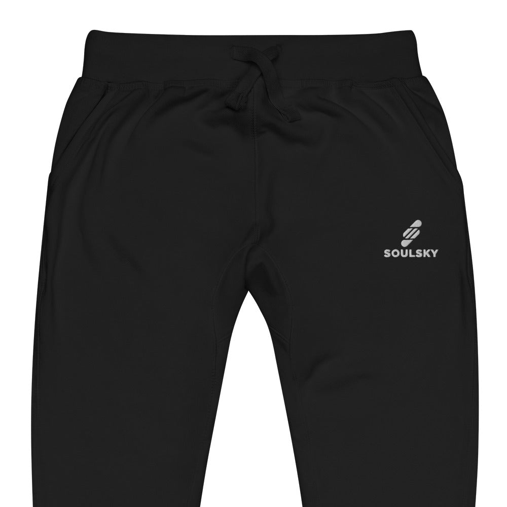 Half pic of Black unisex joggers with white embroidered logo on left thigh that says "SOULSKY".