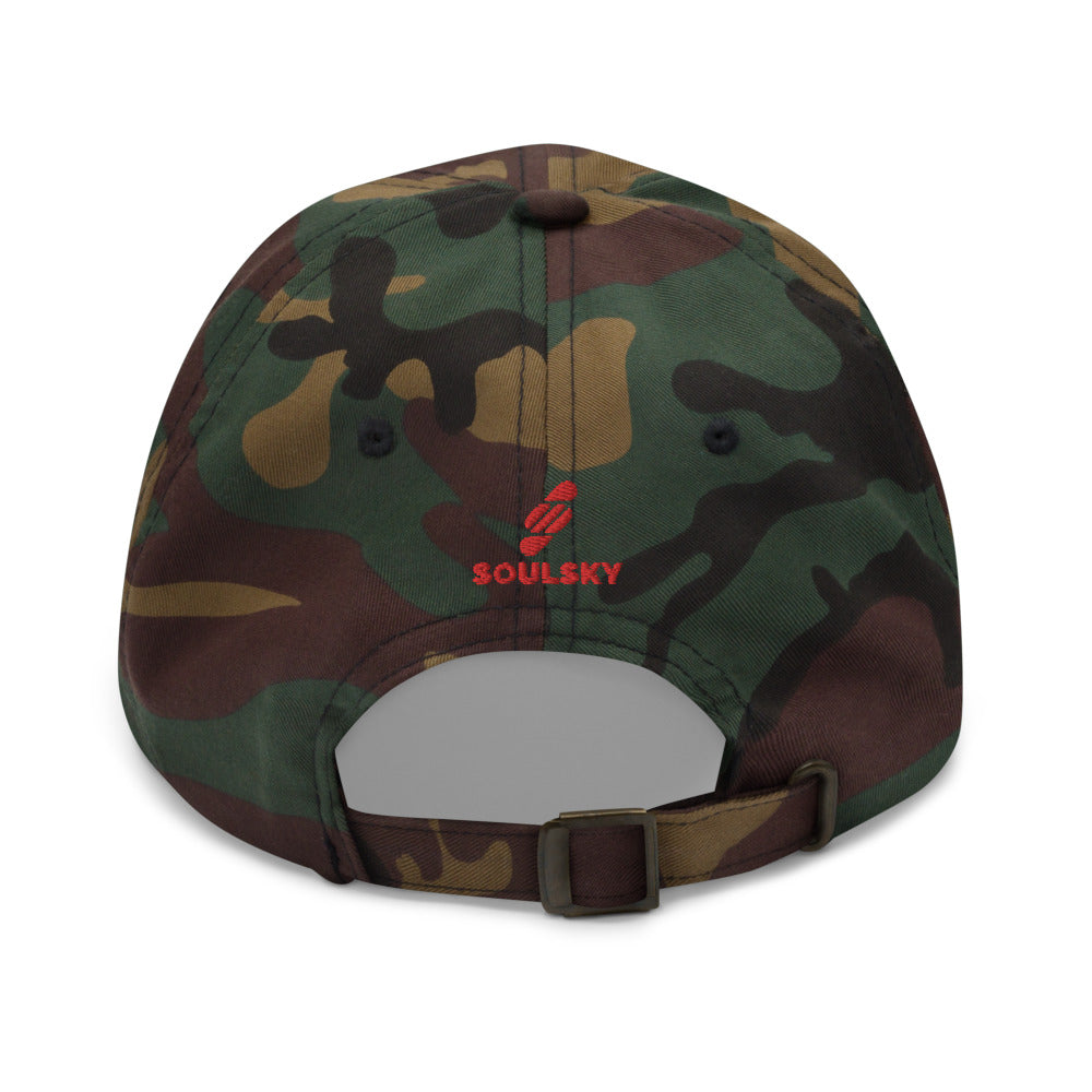 Back of camouflage dad hat. Embroidered red logo that says "SOULSKY". 