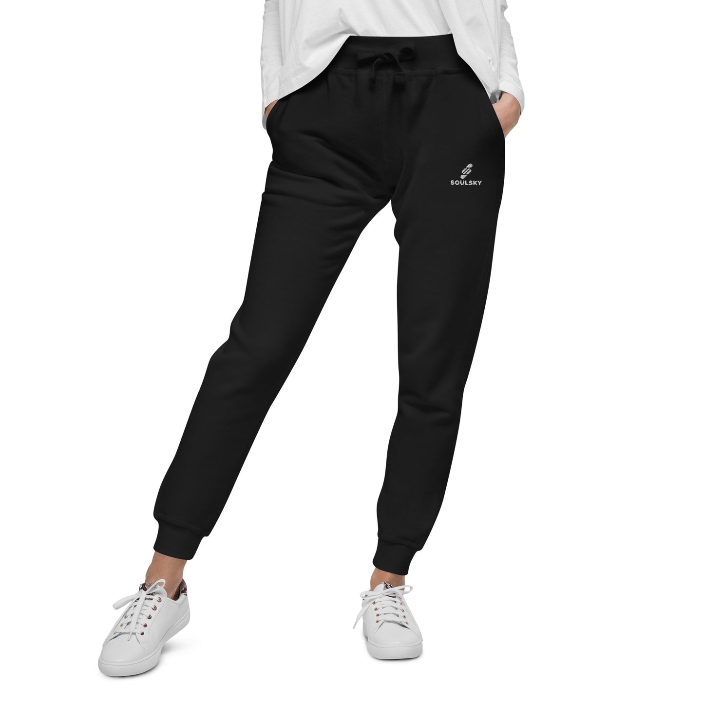 Female model wearing black unisex joggers with white embroidered logo on left thigh that says "SOULSKY".