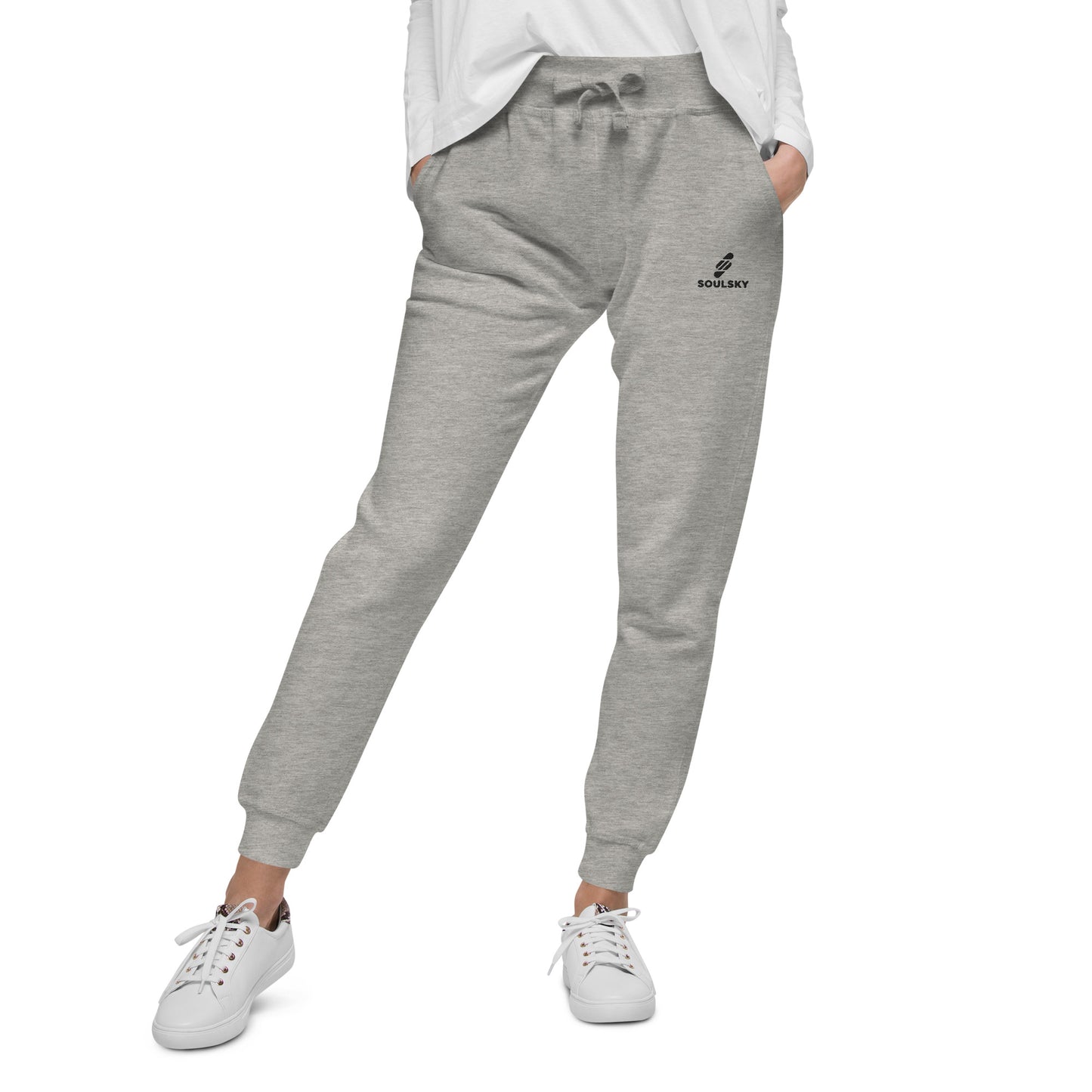 Female model wearing light gray unisex joggers with black embroidered logo on left thigh that says "SOULSKY".