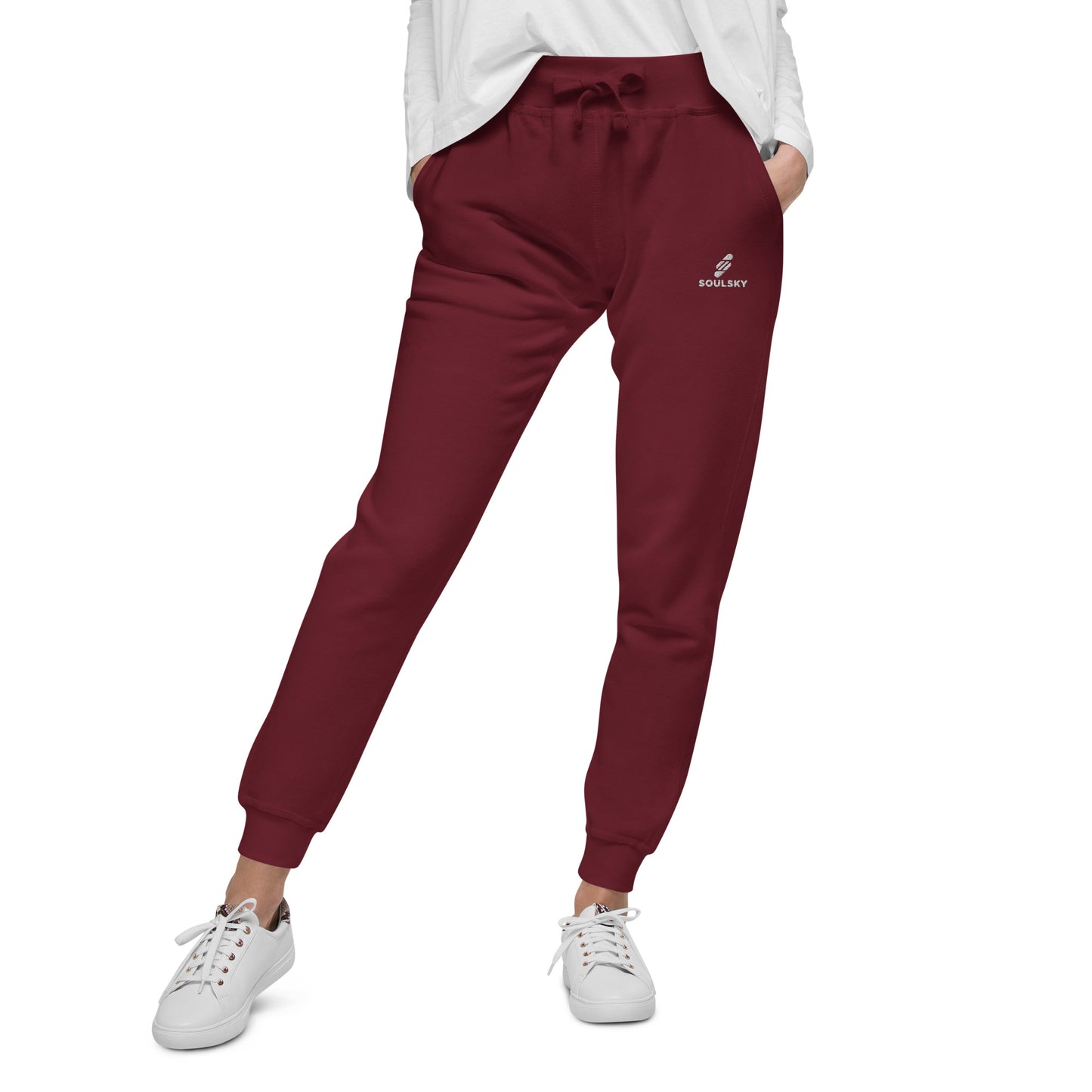 Female model wearing maroon unisex joggers with white embroidered logo on left thigh that says "SOULSKY".