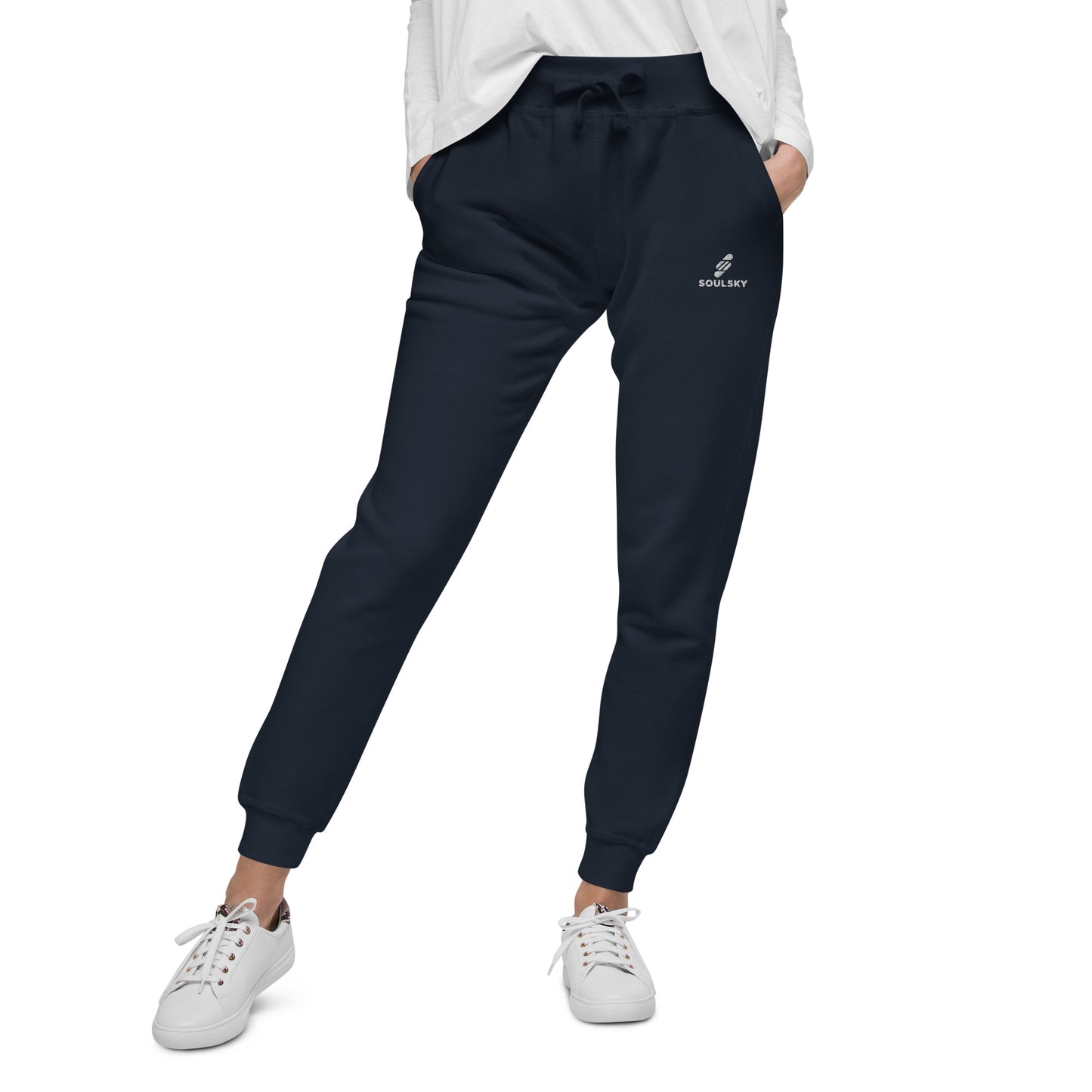 Female model wearing navy blue unisex joggers with white embroidered logo on left thigh that says "SOULSKY".