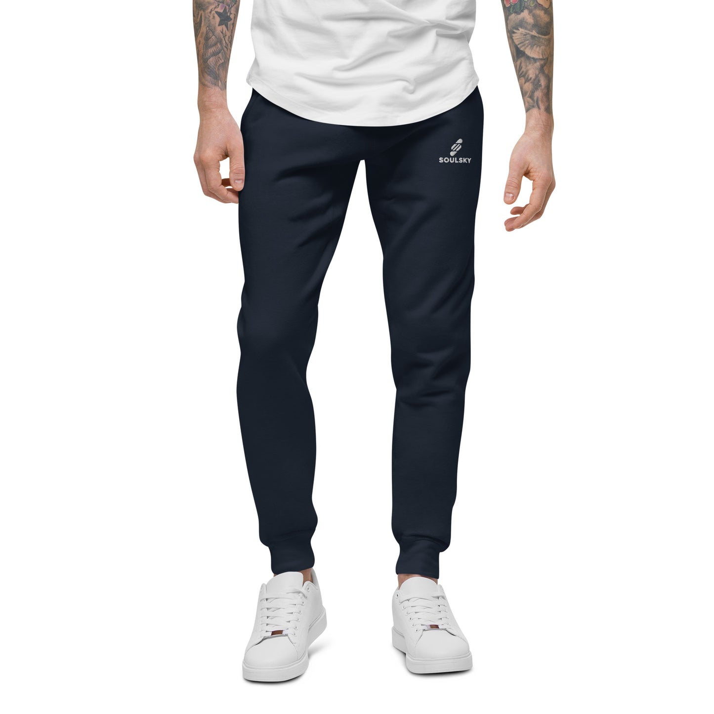 Male model wearing navy blue unisex joggers with white embroidered logo on left thigh that says "SOULSKY".