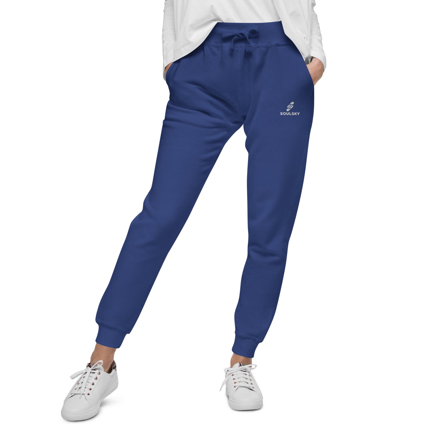 Female model wearing royal blue unisex joggers with white embroidered logo on left thigh that says "SOULSKY".