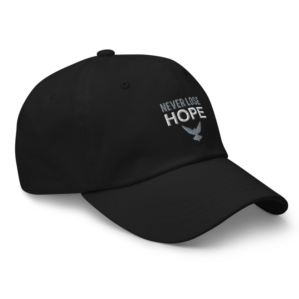 Black dad hat that has embroidered gray and white text that says "NEVER LOSE HOPE" with a gray eagle underneath. Hat is facing to it's left.